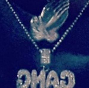 A 200 dollar gang chain with prayer hands